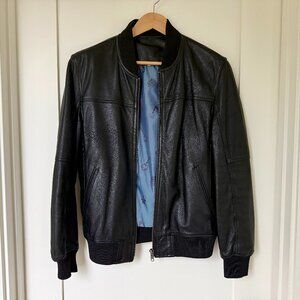 Moroccan leather bomber jacket — Black leather, satin lining — Tag 52 / US M